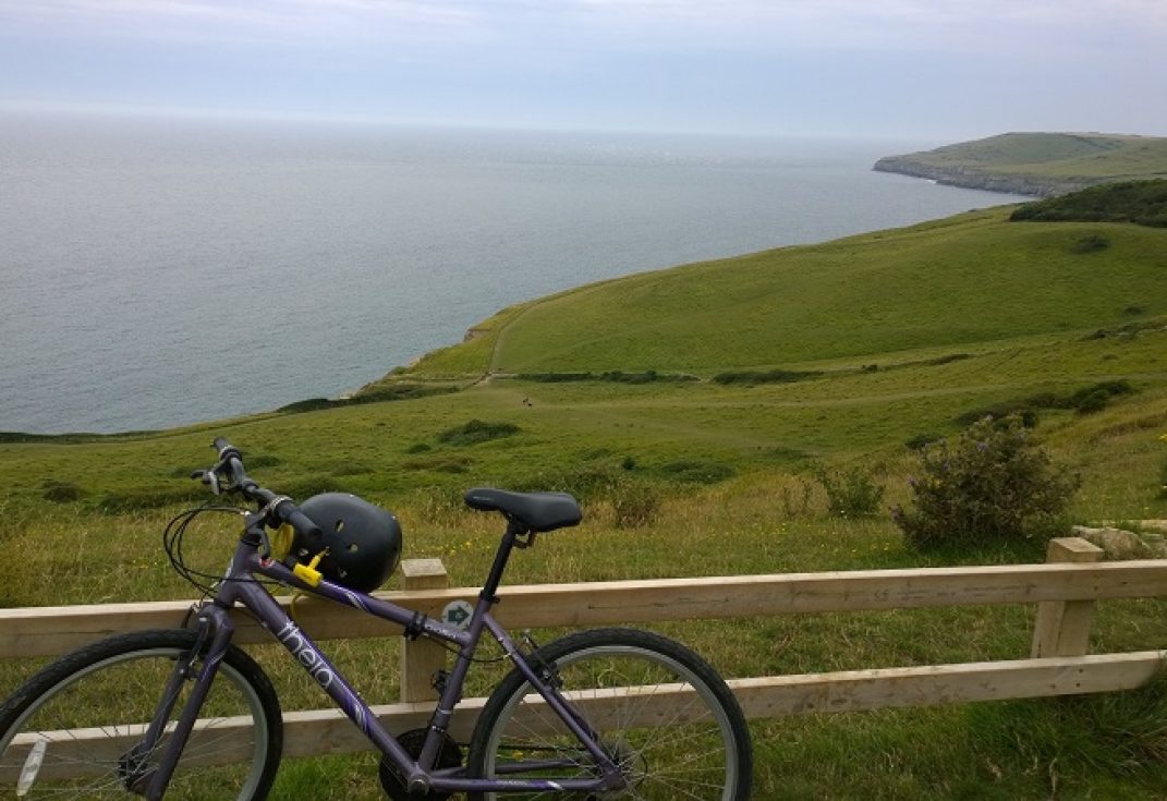 Bike next to coastal scene