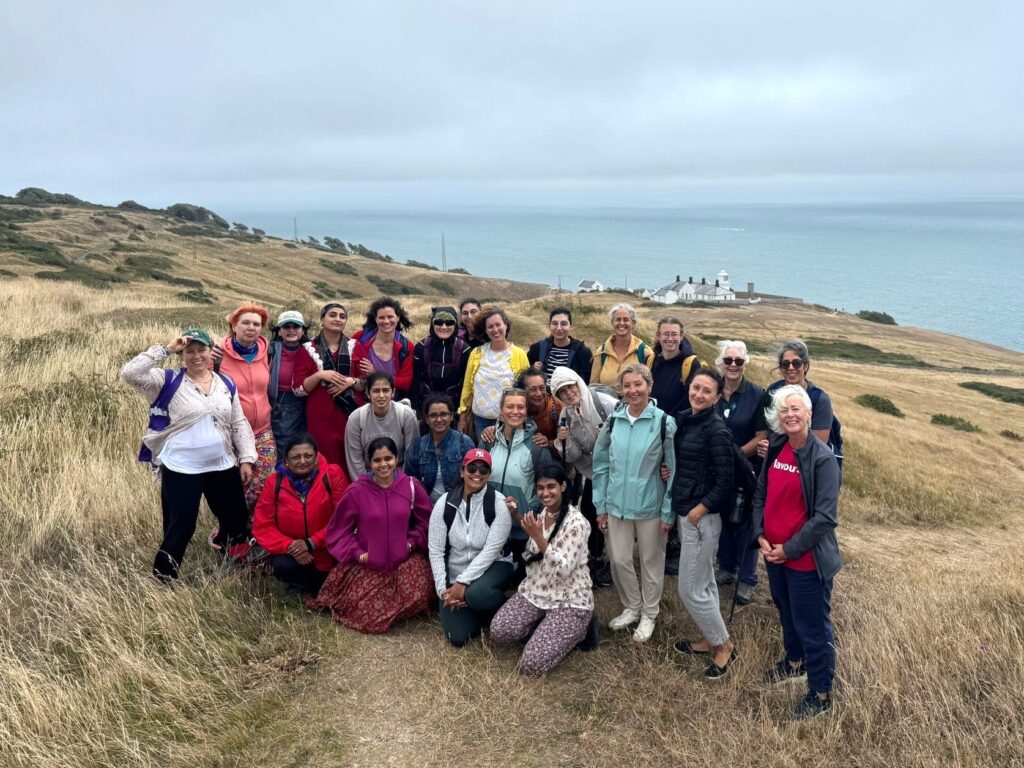 Group of women standing on a cliff at Durlston Country Park
