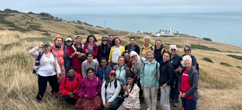 Group of women standing on a cliff at Durlston Country Park