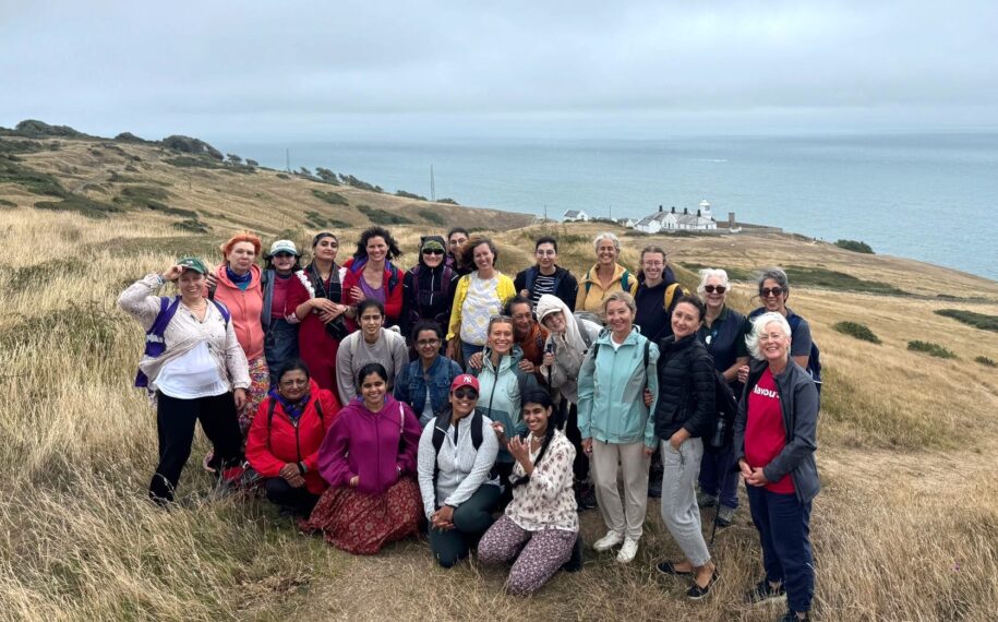 Group of women standing on a cliff at Durlston Country Park