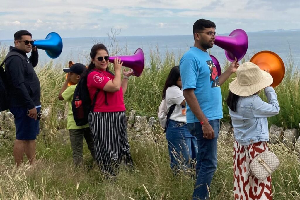 Group of people using geophones