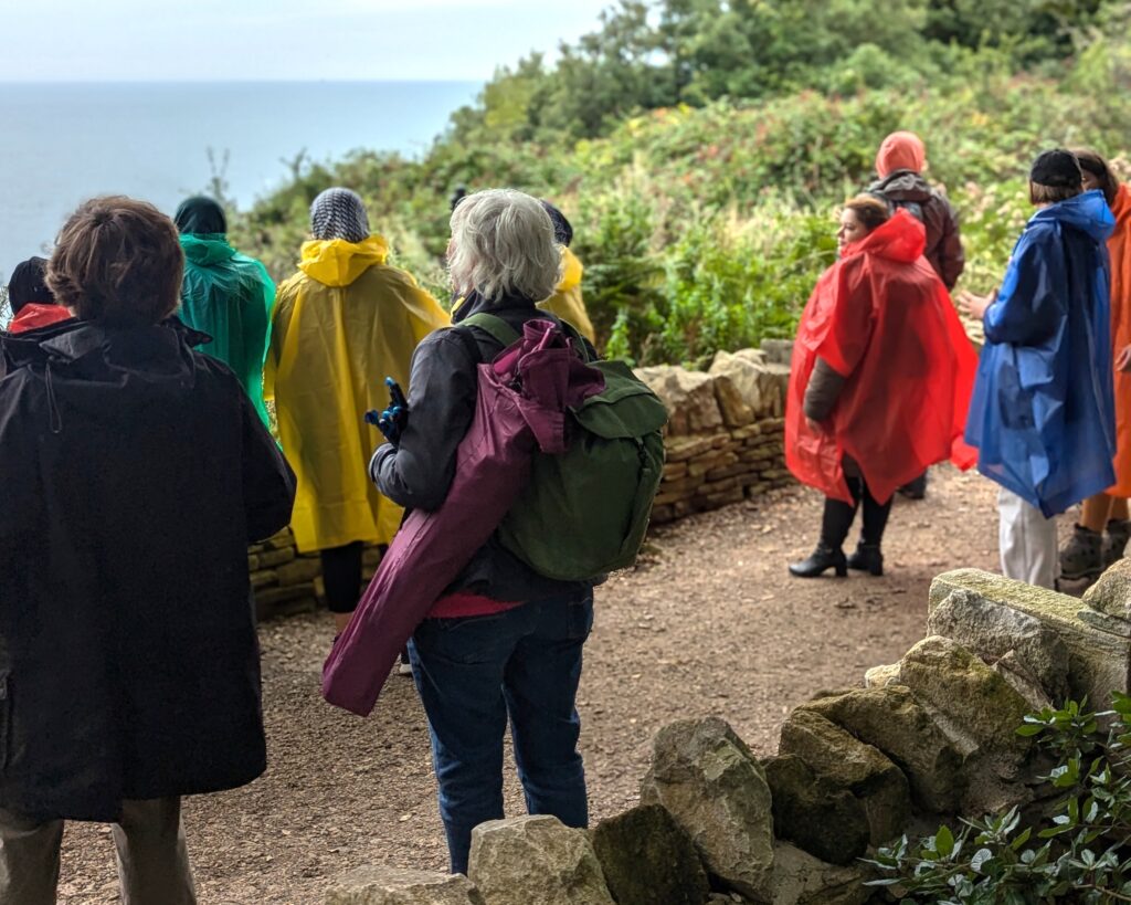 Group of people in colourful rain capes
