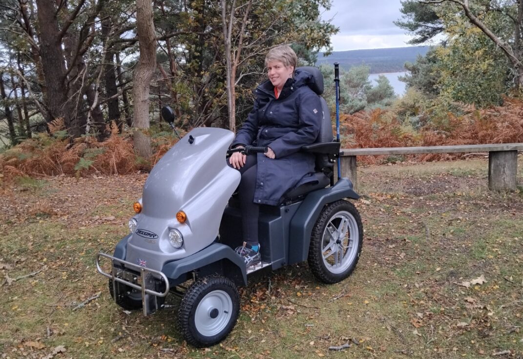 lady sitter on a tramper in a forest.